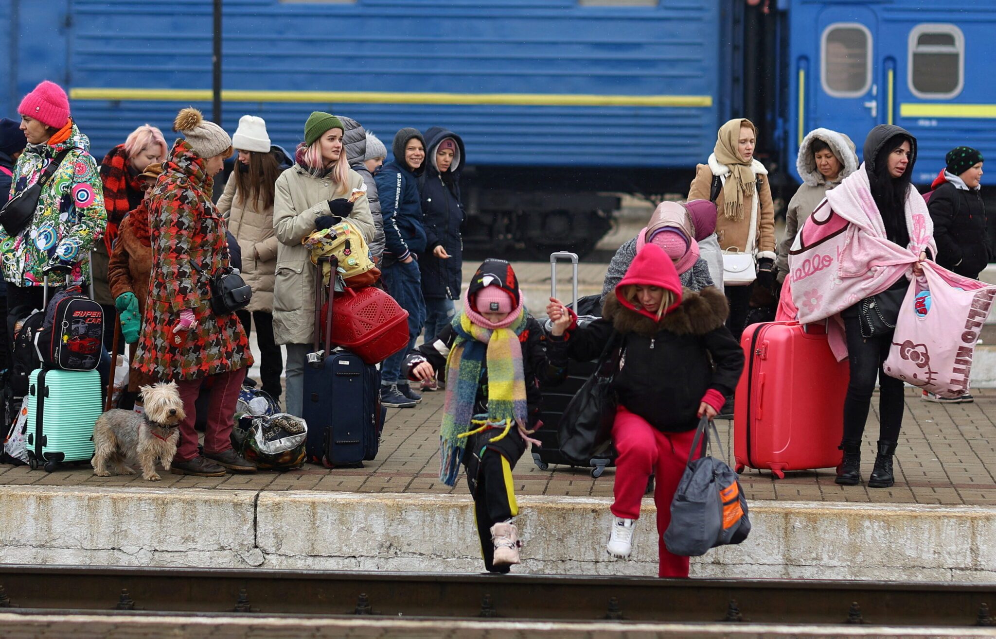 FILE PHOTO: Refugees fleeing the Russian invasion wait for trains to Poland in Lviv